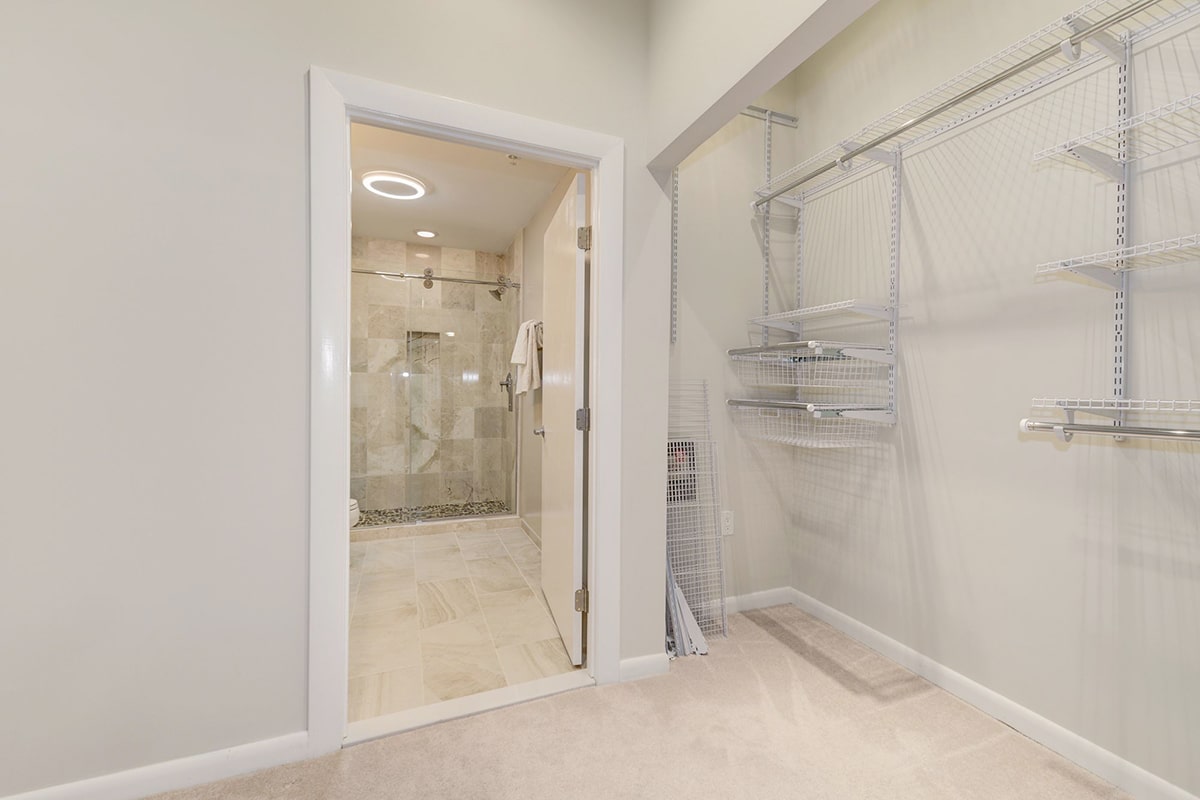 This walk-in closet is large enough to function as a dressing room or study.