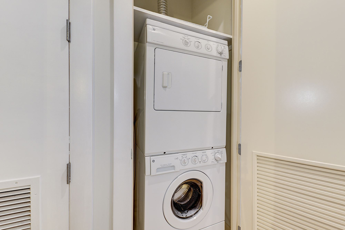 This unit has a private washer and dryer in the hallway.