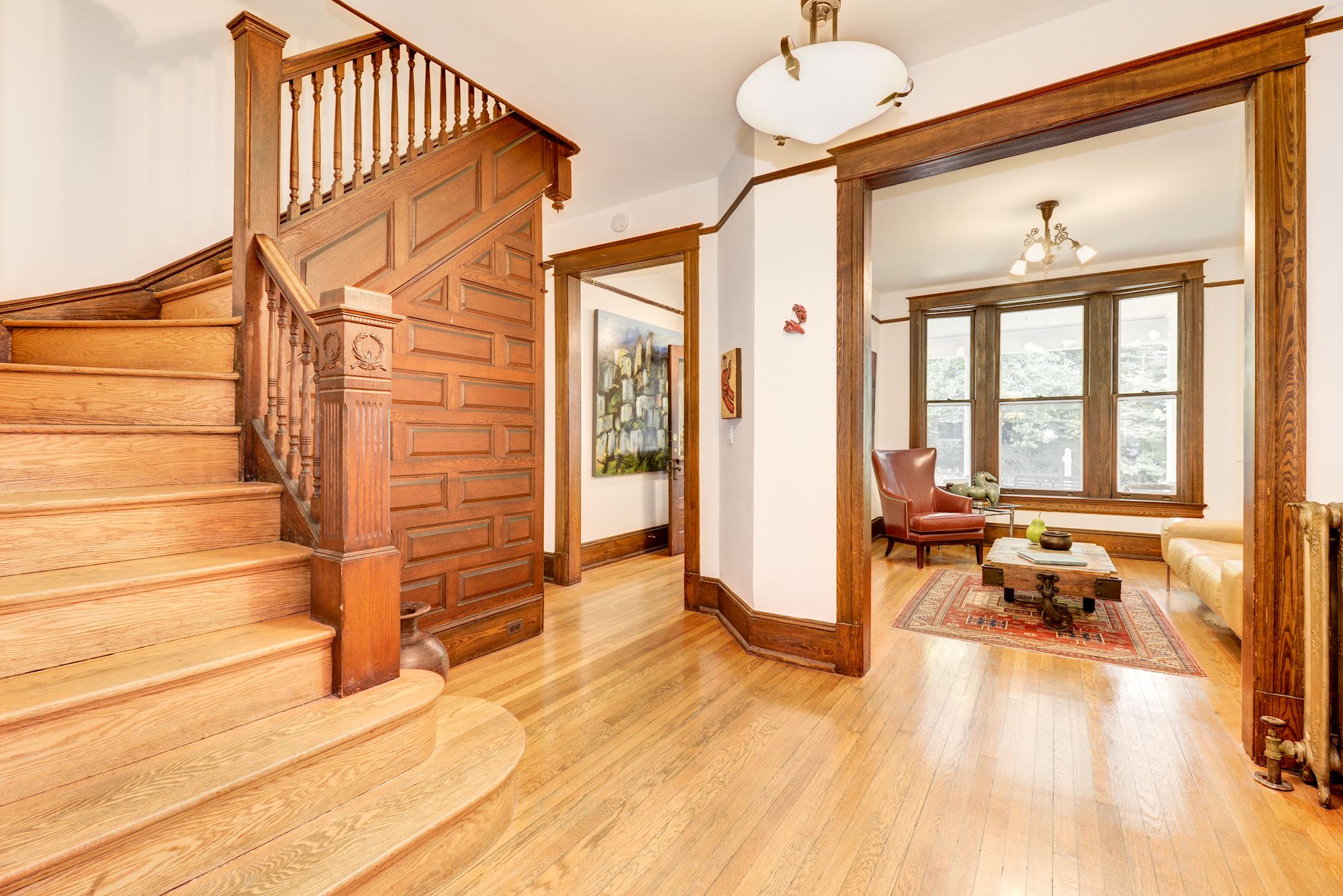 This home retains its gorgeous oak trim and paneled staircase.